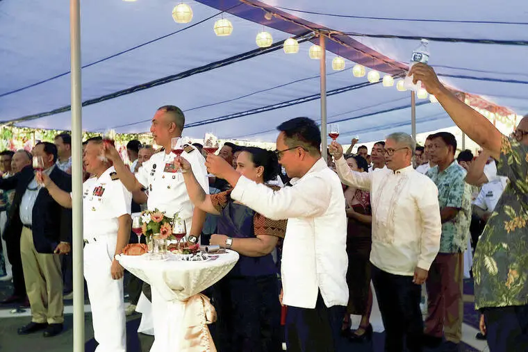 Filipino dignitaries embrace RIMPAC hospitality amid outside protests