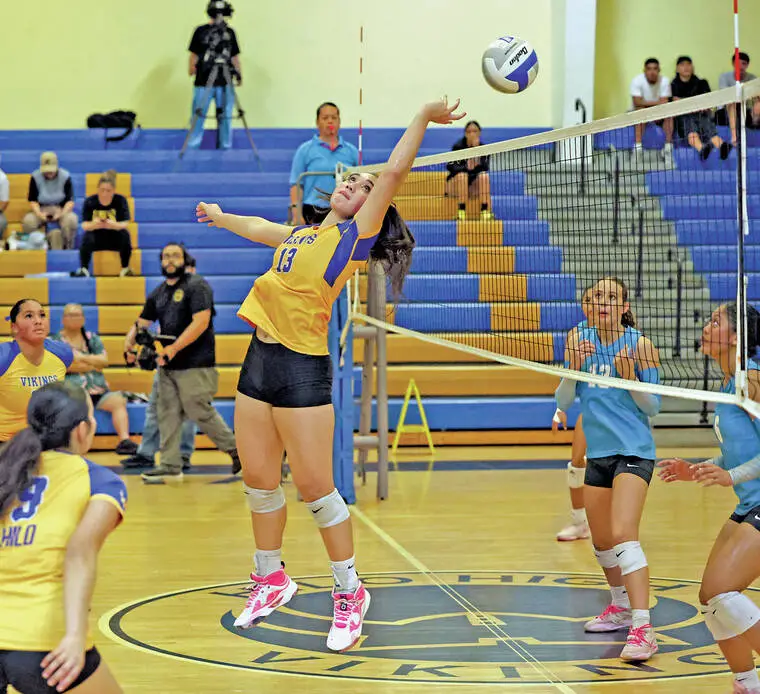 PHOTOS: Vikings volleyball vanquishes ‘Riders